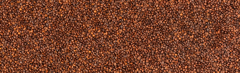 Fresh roasted coffee beans background. Top view. Horizontal banner