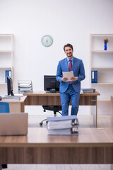 Young male employee working in the office