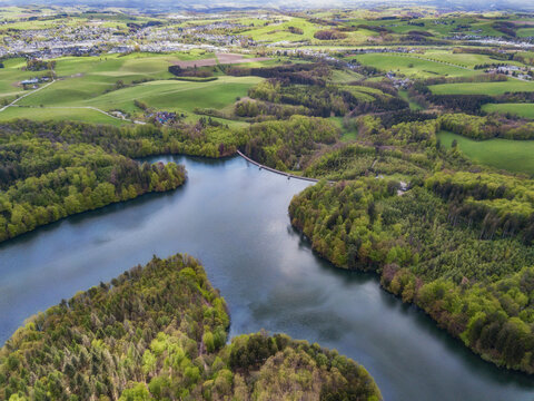 Aerial view of the Neyetalsperre (Neye Dam) in the Bergisches Land with a view of Wipperfuerth in the background.