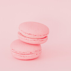Gentle pink macaroons on pink background close-up