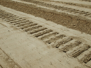Caterpillar tracks in the sand