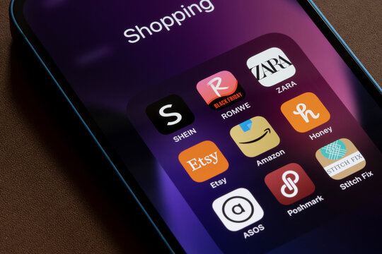Portland, OR, USA - Nov 4, 2021: Assorted shopping apps for women's clothes are seen on an iPhone, including Shein, ROMWE, ZARA, Etsy, Amazon, Honey, ASOS, Poshmark, and Stitch Fix.