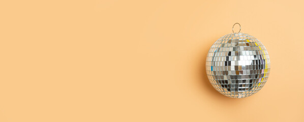 Disco ball on camel background isolated. Horizontal creative poster, greeting cards, headers, website.