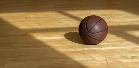 iBasketball court wooden floor with professional brown leather ball and shadows. Horizontal sport poster, greeting cards, headers, website