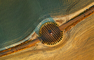 Aerial view of the beautiful hills of the Val d'Orcia in Tuscany with the cypress circle shape...