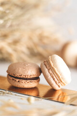 neutral color macaroons on a table, 