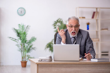 Old male employee and too much work in the office