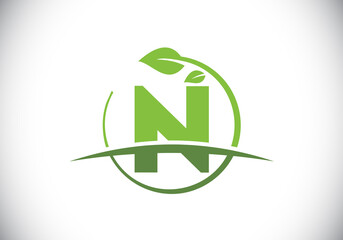 Initial N monogram alphabet with circle leaf and swoosh. Eco-friendly logo concept. Font emblem. Modern vector logo for ecological business and company identity