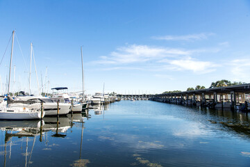 Fototapeta na wymiar Marina with white yachts under blue sky