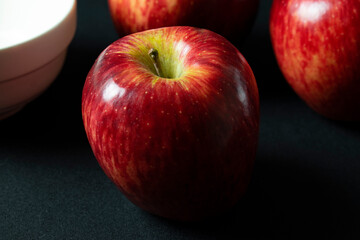 red apples on black background