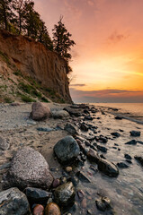 Baltic sea coast, beach and cliffs at Gdynia Orlowo during sunrise, Poland