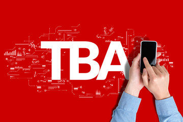 Business acronym TBA or To Be Announced. Person uses a smartphone