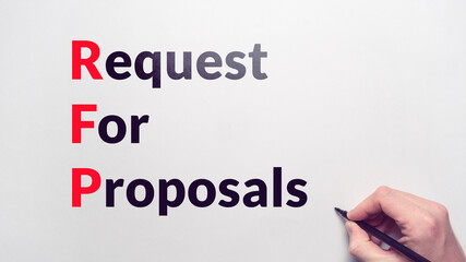 Business acronym RFP or Request For Proposals. Person draws with a marker