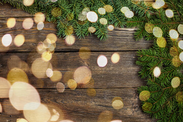 New year concept with spruce, boken and wooden texture. Copy space. Top view of a Christmas...