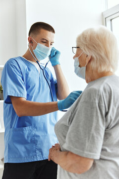 doctor in medical mask with stethoscope checkup