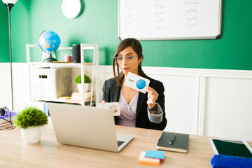 Beautiful woman using flashcards