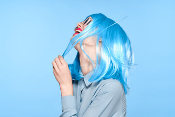 cheerful woman wearing sunglasses blue wig glamor model