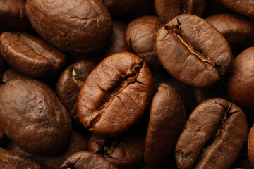 Pile of roasted coffee beans as background, closeup