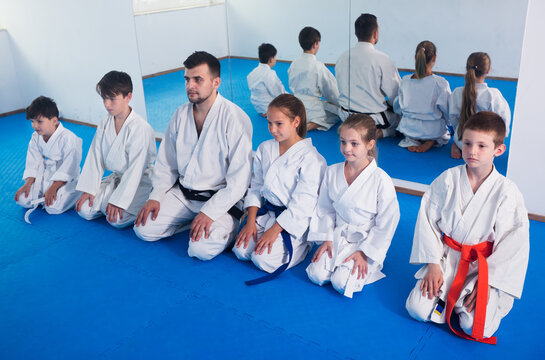 Young children expressing interest in attending karate class