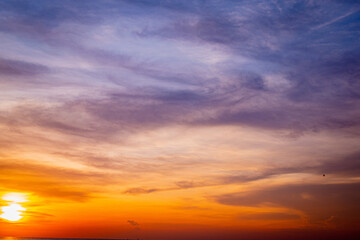 Fototapeta na wymiar The sunset shines brightly on the beautiful sky skyline.