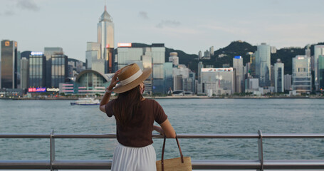 Woman enjoy night view in Hong Kong city