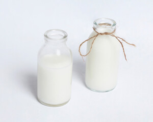 White milk drink served with bread is good for breakfast in the morning. This fresh cow's milk in addition to its sweet taste also contains many nutrients. warm milk in a glass cup.