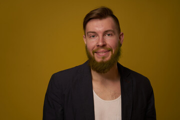 bearded man fashionable hairstyle jacket posing self confidence
