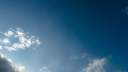 Naklejka na ściany i meble blurred blue sky with clouds and sun in Brazil