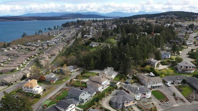 Cinematic 4K aerial drone footage of Ship Harbor, Guemes Channel, Portalis, Channel Landing, waterfront by Anacortes, Washington and surroundings, a charming, quaint old town near Seattle, Washington