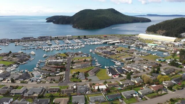 Cinematic 4K aerial drone footage of Burrows Pass and Island, Tugboat Beach, Portalis, Anaco Beach, Washington Park, Anacortes waterfront, a charming, quaint old town near Seattle