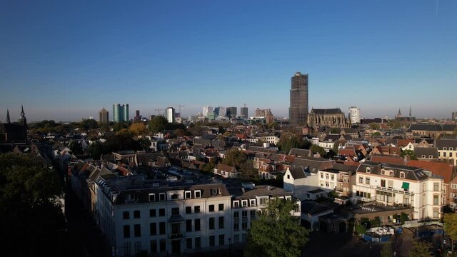 Lepelenburg park with the cityscape of Utrecht in the background where the scaffolded church tower rises above the urban Dutch city.