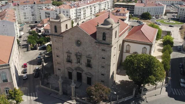 Aerial orbiting S&atilde;o Miguel Church Facade, Downtown Castelo Branco City - Portugal