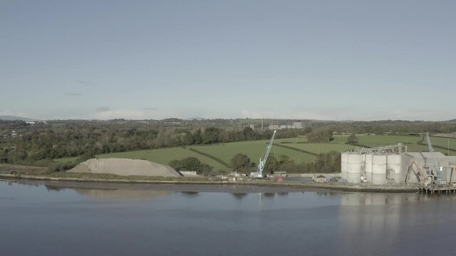 Aerial across River Suir to mobile crane at O'Brien Cement plant