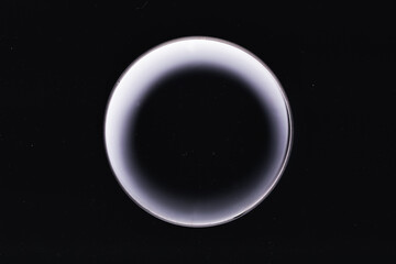 Abstract space wallpaper. White moon. White glowing circle on black background