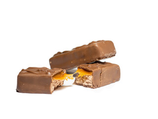 Broken chocolate bar on a white background. Slices of chocolate.