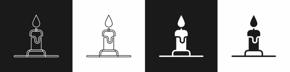 Set Burning candle in candlestick icon isolated on black and white background. Cylindrical candle stick with burning flame. Vector