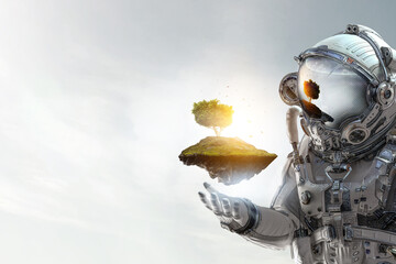 Astronaut against cloudy sky background