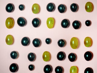 Background from grapes. Green and black grapes.