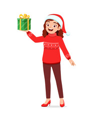 young woman holding box present in christmas