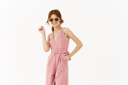 pretty woman in pink suit sunglasses fashion summer style posing