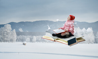 Little girl reading a book