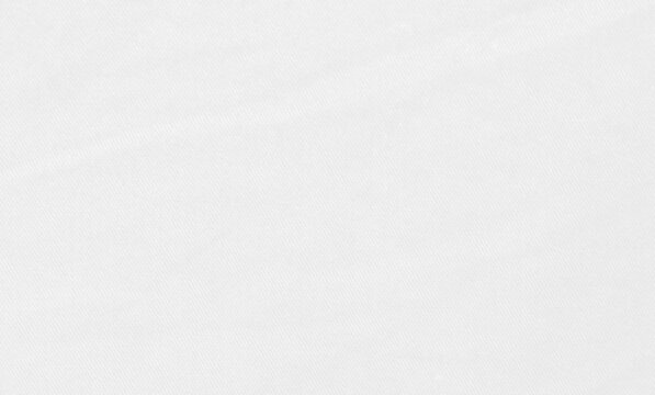 Blurred white fabric texture full frame for background, blurry white abstraction.