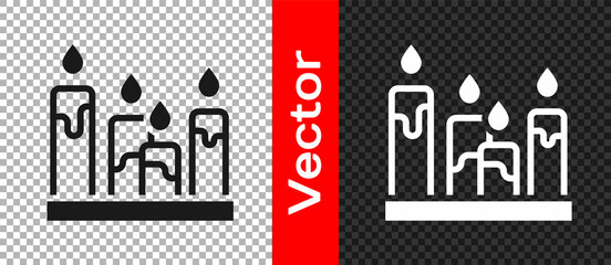 Black Burning candle icon isolated on transparent background. Cylindrical aromatic candle stick with burning flame. Happy Halloween party. Vector