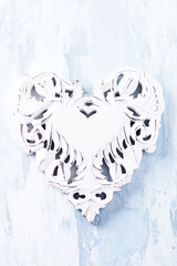 Wooden Heart on bright background. Christmas decoration. Top view. Close up. Copy space. 