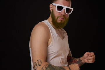 bearded macho man in white t-shirt sunglasses fashion tattoos