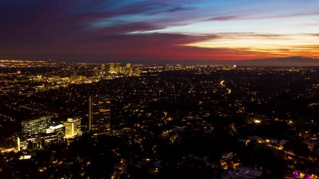Hyper lapse over the illuminated Beverly Hills cityscape, dusk in Los Angeles, California