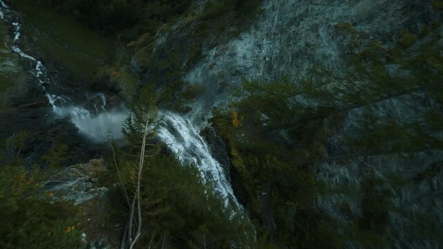 FPV drone view diving down the Jungfernsprung waterfall in Austria - POV aerial