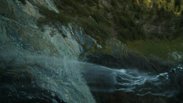 FPV drone view around the Jungfernsprung waterfall in sunny Austria - POV aerial
