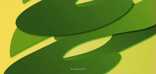 Green abstract shape isolated on a yellow background, looks like a plant in the afternoon.