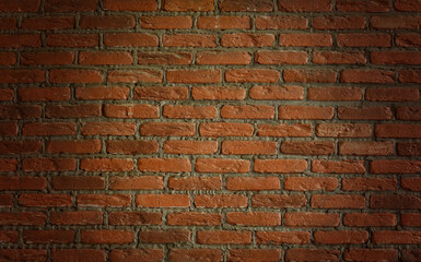 Background texture of red-brown brick wall. Copy space for text.Vignette